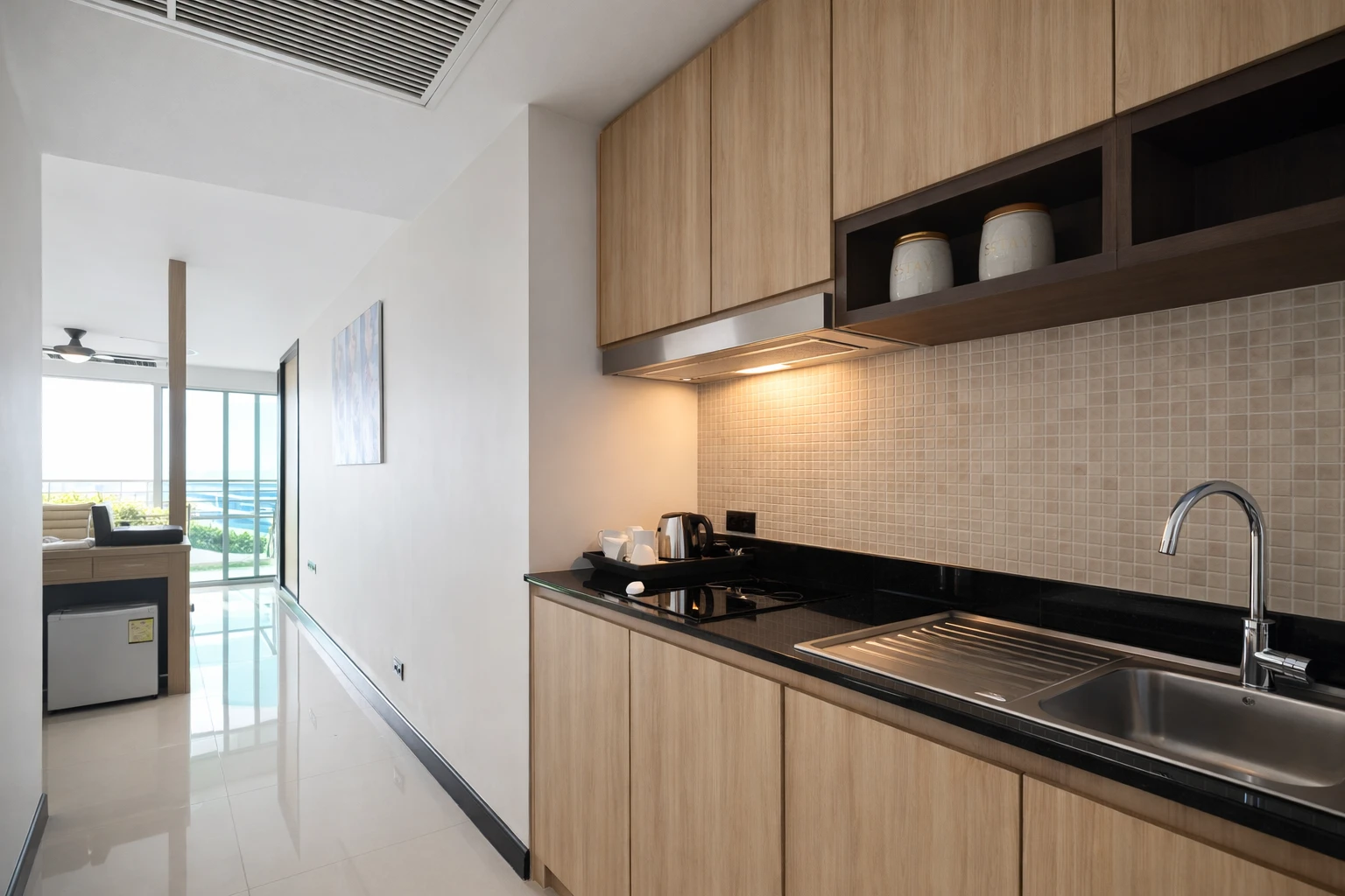 The kitchenette, with the room and the sea beyond