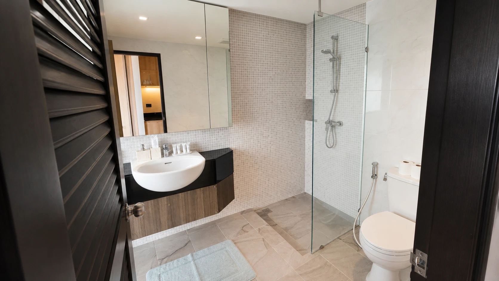 The bathroom, with a glass-screened shower