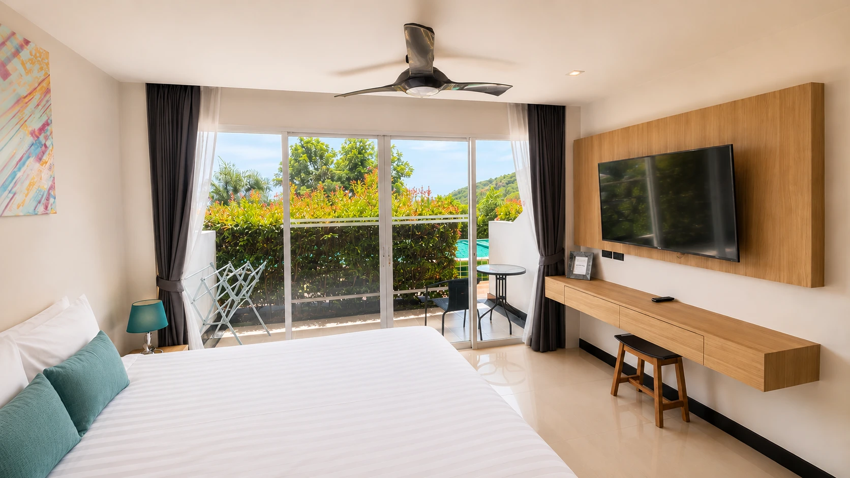 Standard Pool Access: king bed facing the terrace doors, with the pool just beyond the hedge